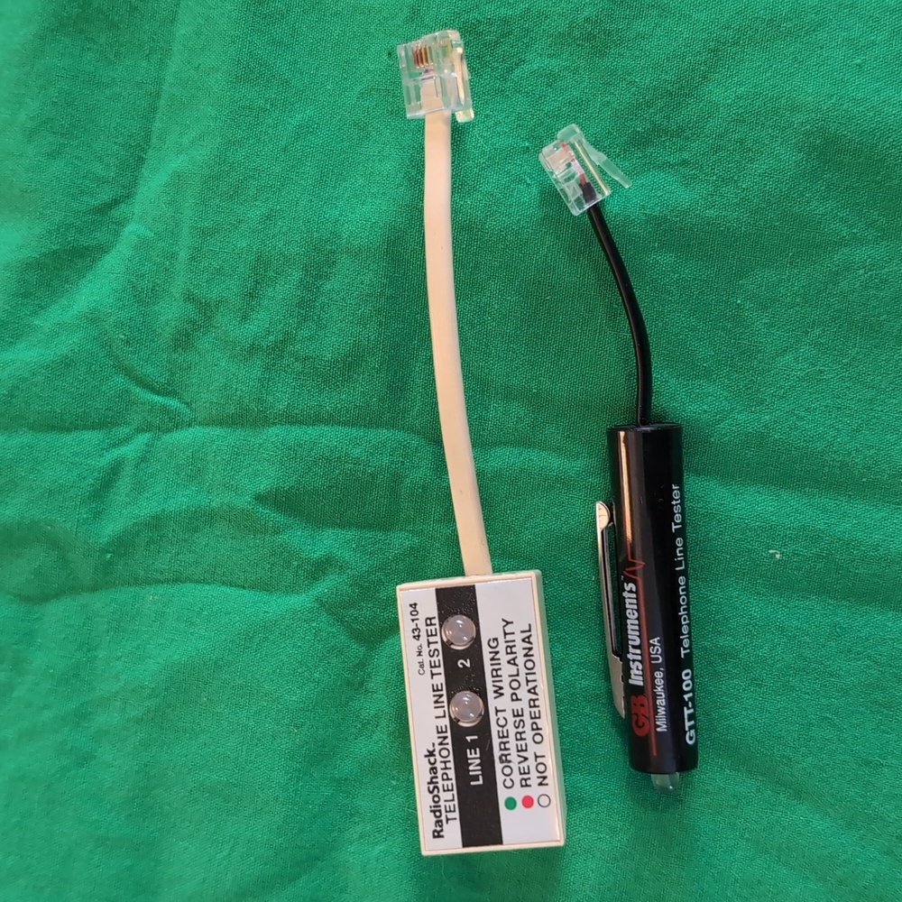 Radioshack and GB Instruments Telephone Line Testers Black White